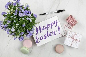flowers, presents and a message saying Happy Easter