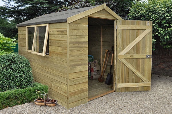 wooden tongue and groove shed with door open and window ajar in a garden setting