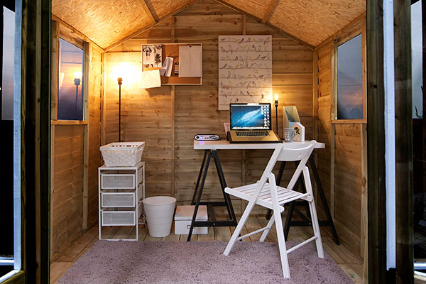 a shed with solar lighting, kitted out as a home office