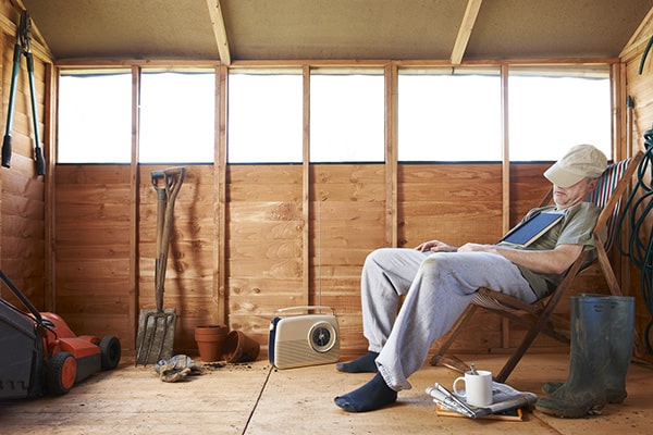 man asleep in his shed