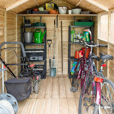 tools, bikes and garden equipment, stored inside an overlap shed