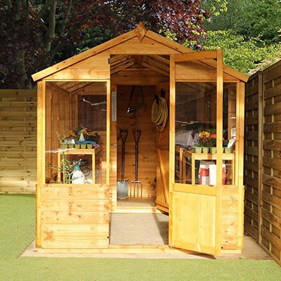 a front view of a wooden potting shed