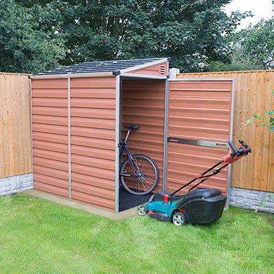 5x6 amber-coloured, pent, plastic shed in a  garden