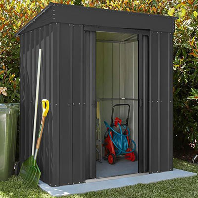 a cheap garden shed, made from galvanised steel and with sliding double doors