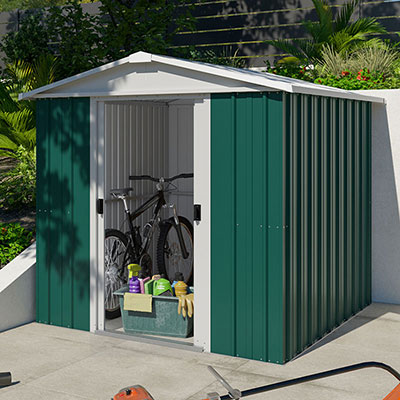 a green metal shed with sliding double doors