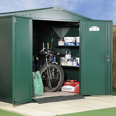 a 7x7 green metal security shed containing garden equipment and a bike