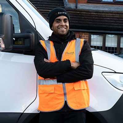 a shed delivery man standing by a white van