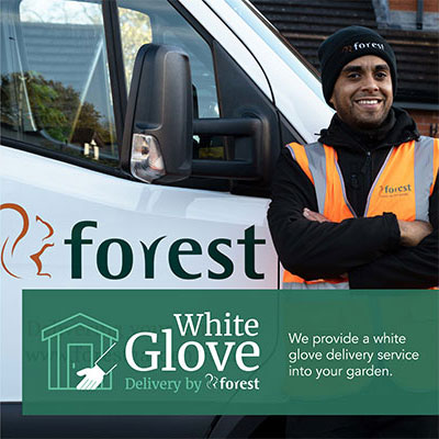 a shed courier standing next to a white van, with an overlay advertsising Forest's White Glove Delivery Service