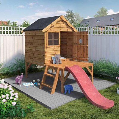a kids' wooden playhouse with ladder, tower and slide