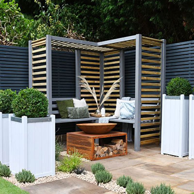 a corner arbour seat with slatted panels