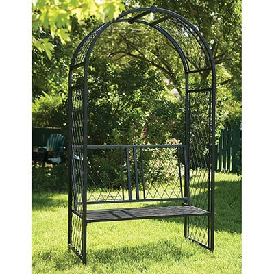 a black metal garden arch with lattice sides and a seat