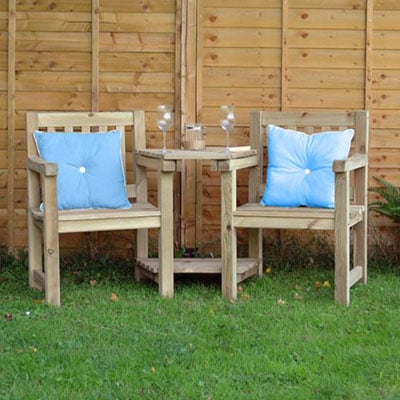 a wooden love seat, including a garden table and chairs