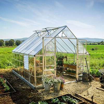 a 10x12 polycarbonate greenhouse with double doors and 4 roof vents