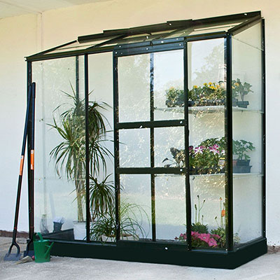 A 6x2 lean-to greenhouse with a green aluminium frame