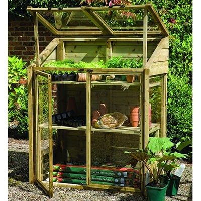 a small, wooden lean-to greenhouse with open doors and vents