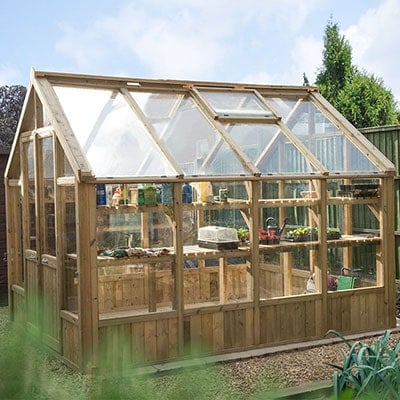 A 10x8 wooden greenhouse with double doors and a roof vent