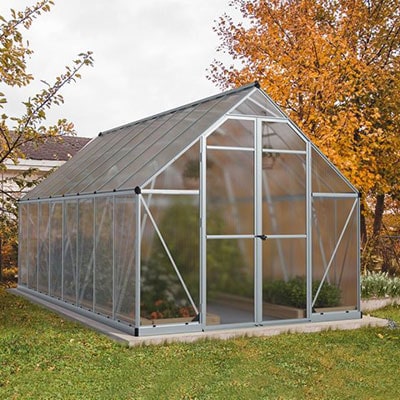 a large polycarbonate greenhouse with double doors