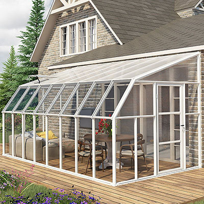 a polycarbonate sunroom/ greenhouse with a white frame