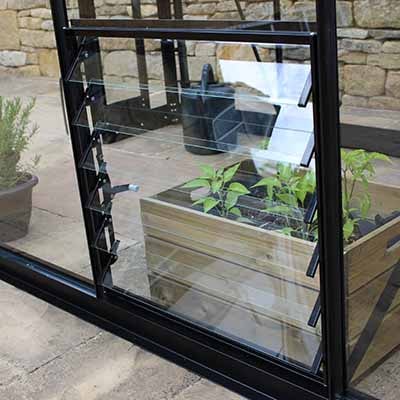 A greenhouse louvre window