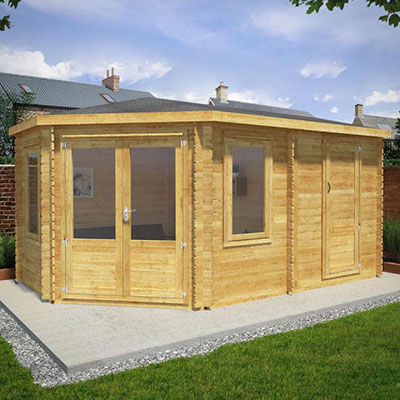 a corner log cabin with side shed