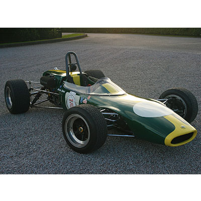 an old, green Lotus sports car 