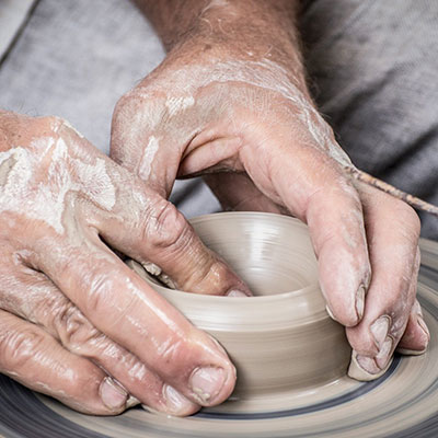 somebody using a potter's wheel
