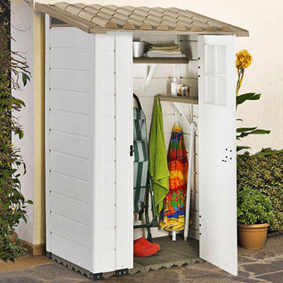 a white plastic garden storage shed full of outdoor equipment