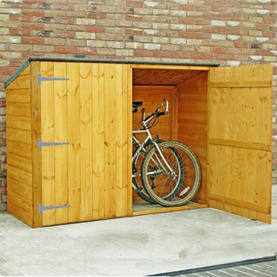a wooden bike shed with double doors