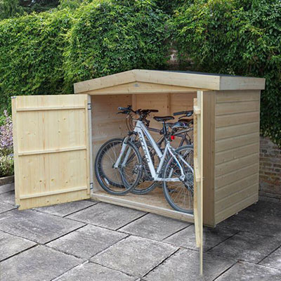 2 bicycles inside a wooden bike storage shed