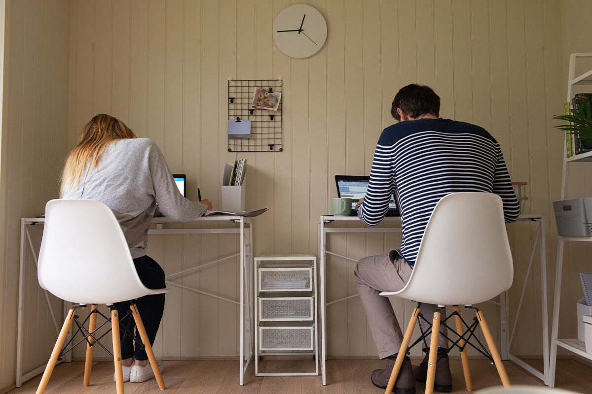 Photo of a couple working in a Garden Office