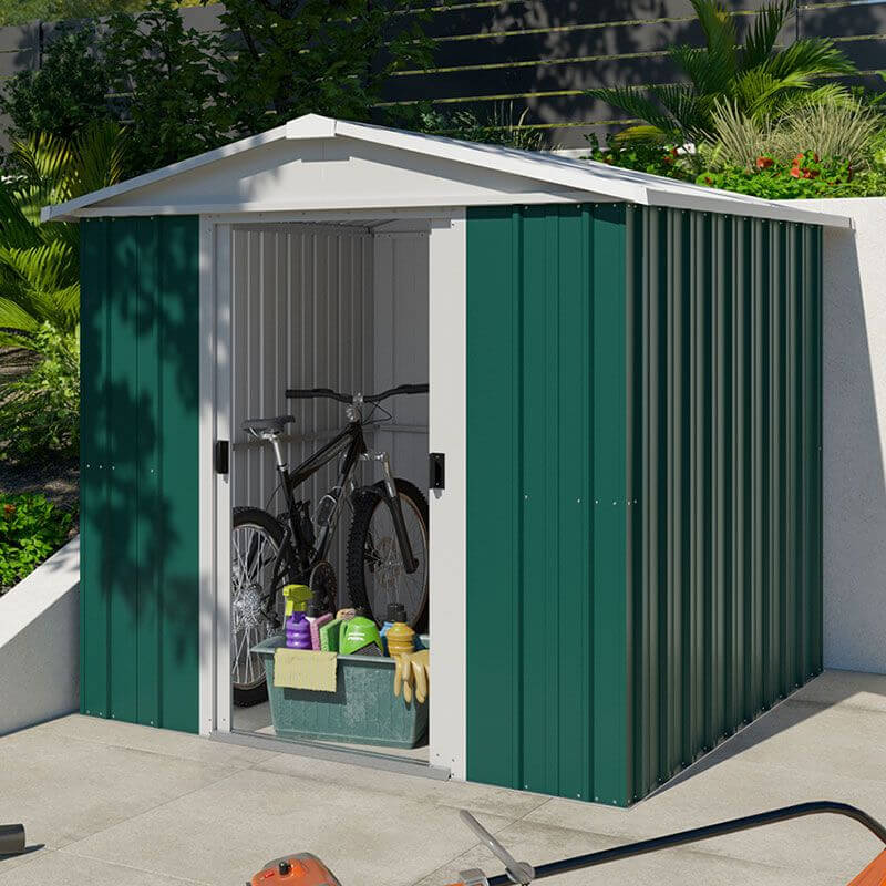 a green metal shed with a bicycle in it