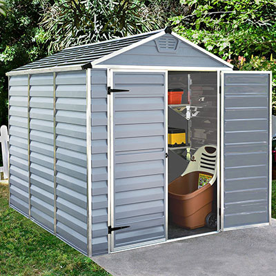 A grey, plastic shed with a skylight roof and a door open to reveal garden equipment