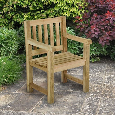 A simple wooden garden seat with armrests