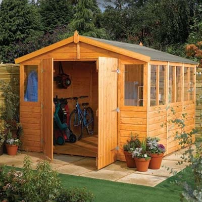 a wooden garden workshop with open double doors and a large number of windows