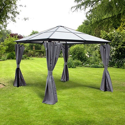 A polycarbonate gazebo with a pyramid-shaped roof and grey curtains