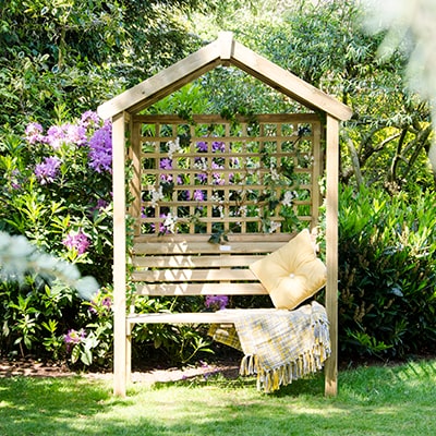 a wooden garden arbour for 2, with an apex roof and trellis sides