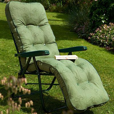 a relaxer garden chair with a green, patterned cushion 