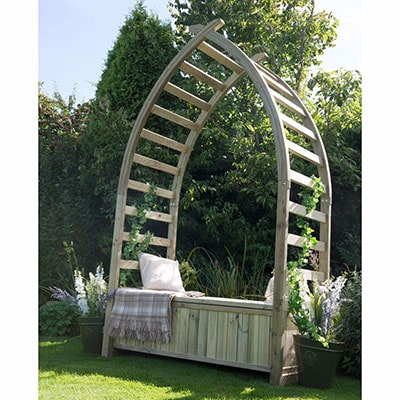 A garden arbour consisting of a curved arch and a wooden bench seat.