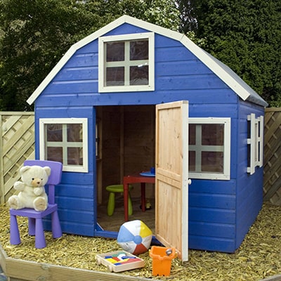 a blue playhouse, designed like a Dutch barn, fitted with 5 windows and a door